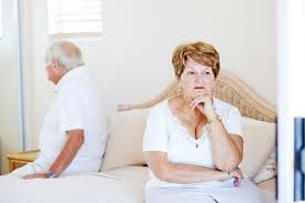 husband and wife on bed